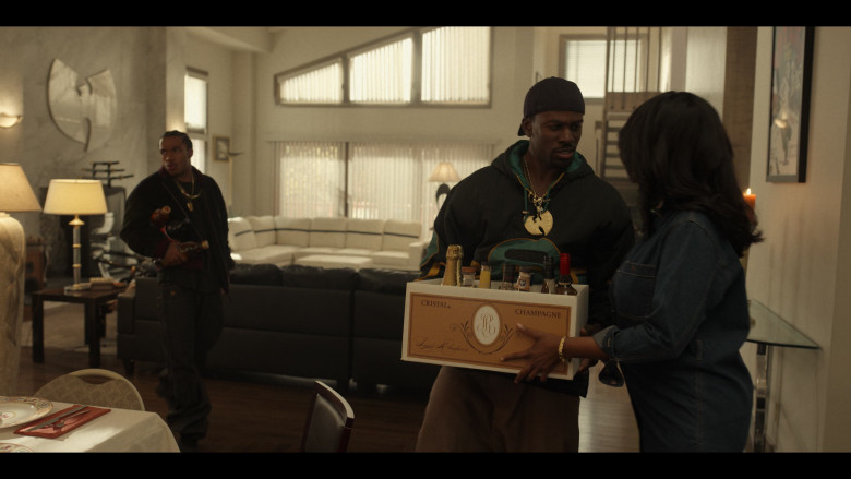 Character holding a box of Cristal Champagne in Wu Tang : An American Saga