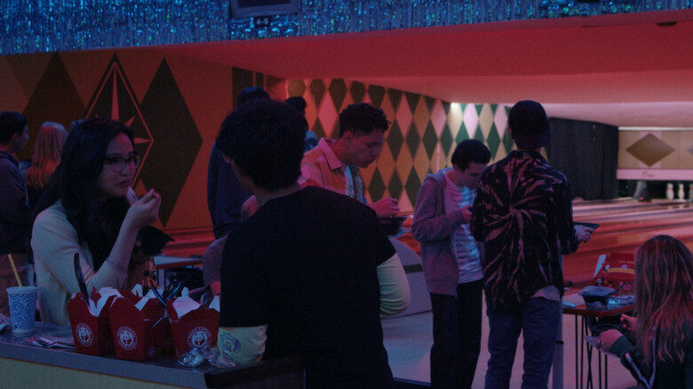 Characters having Panda Express at a bowling alley in American Born Chinese
