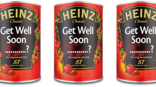 Three cans of Heinz tomato paste