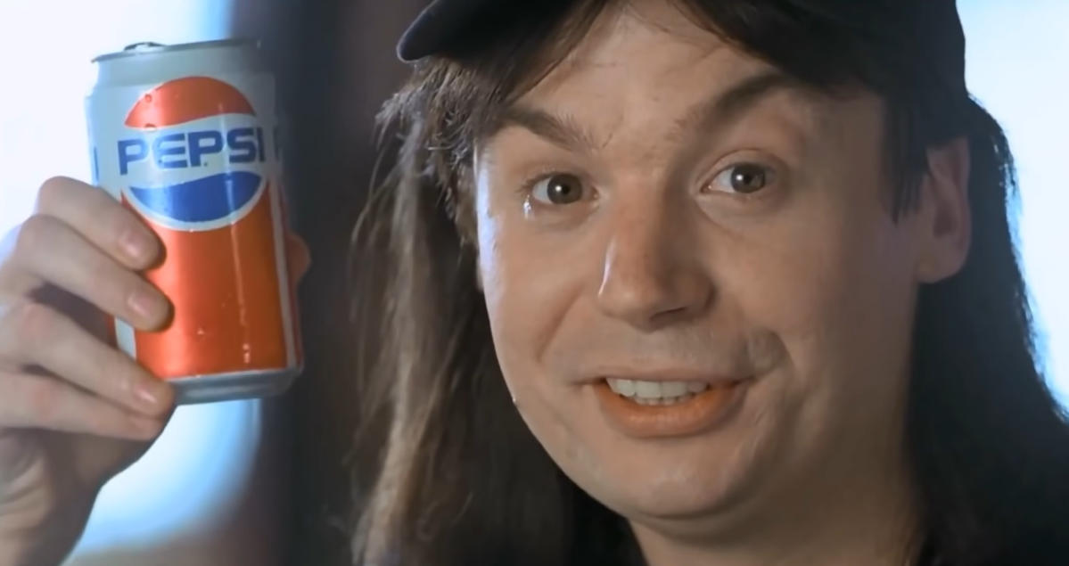 Wayne from Wayne's World holding a Pepsi can.