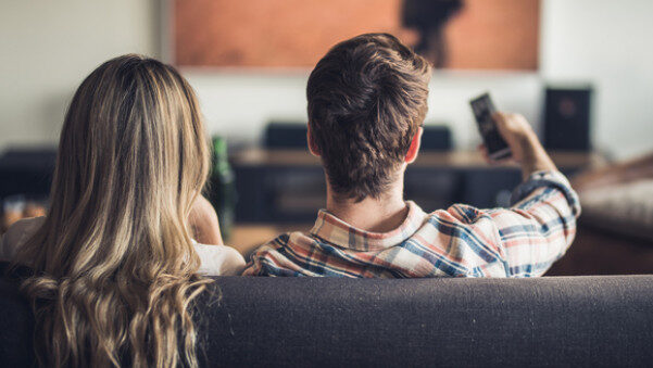 A couple watching TV at home